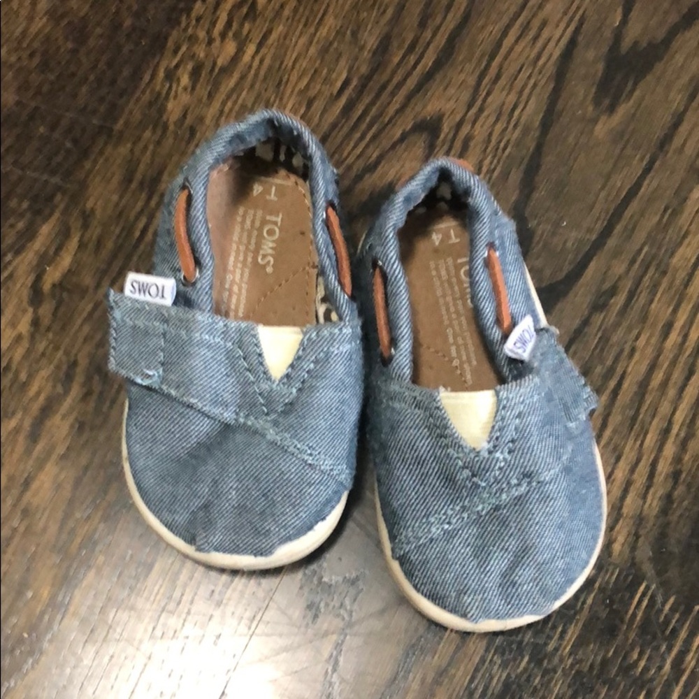 Toms baby slip on shoe with velcro closure.